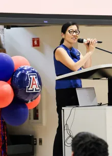 Vice President for Arizona International and Dean of International Education Dr. Jenny Lee addresses a crowd from a podium.