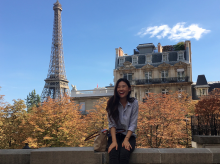 UA Study Abroad Student Stephanie Kim in Paris, Eiffel Tower in background.