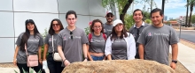 eight med students from Universidad del Valle de México wearing gray A-Public Health t-shirts