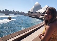 Arizona Alumna Dominique standing in front ot the Sydney Opera House