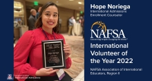 Hope Noriega holds her award plaque for NAFSA Region 2 International Volunteer of the Year