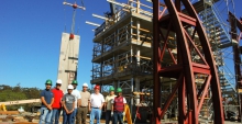 Robert Fleischman and members of his research team stand dwarfed by a test structure built on the shake table at UC San Diego’s Englekirk Structural Engineering Center