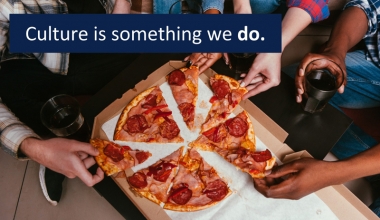 Students eating a pizza together and the words: Culture is something we do.