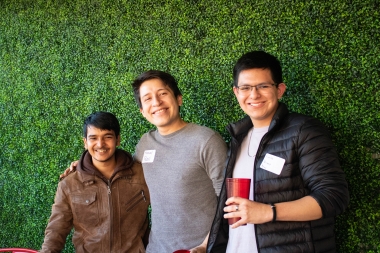 Carlos Verano (left) with some new friends at the party. 