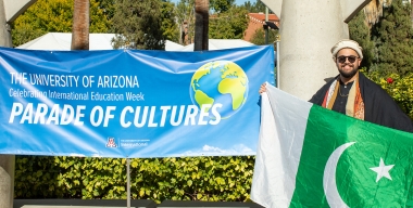 Student dressed in traditional clothing from his home country, attending the Parade of Cultures, IEW2022